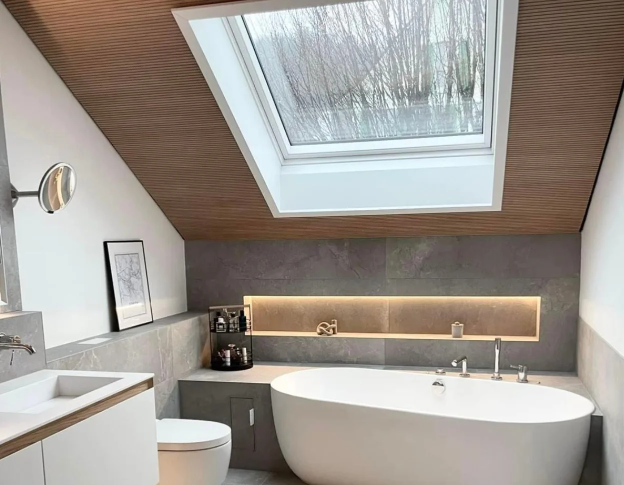 Custom skylight addition attic Kirkland illuminating marble countertop and chrome fixtures in modern remodel.
