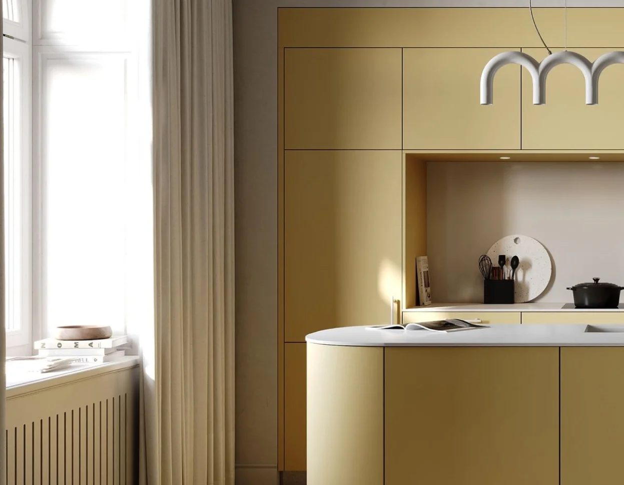 Butter yellow kitchen cabinets with brass hardware and white marble countertops, 2026 trends